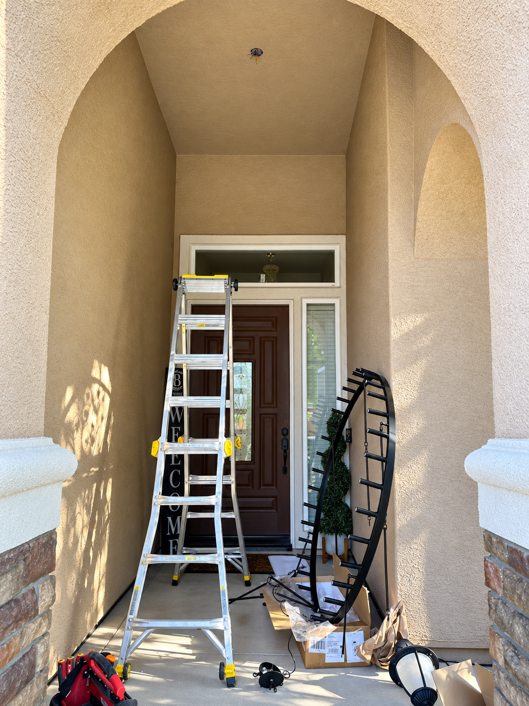 Outdoor chandelier installation in progress in Yuba City, California