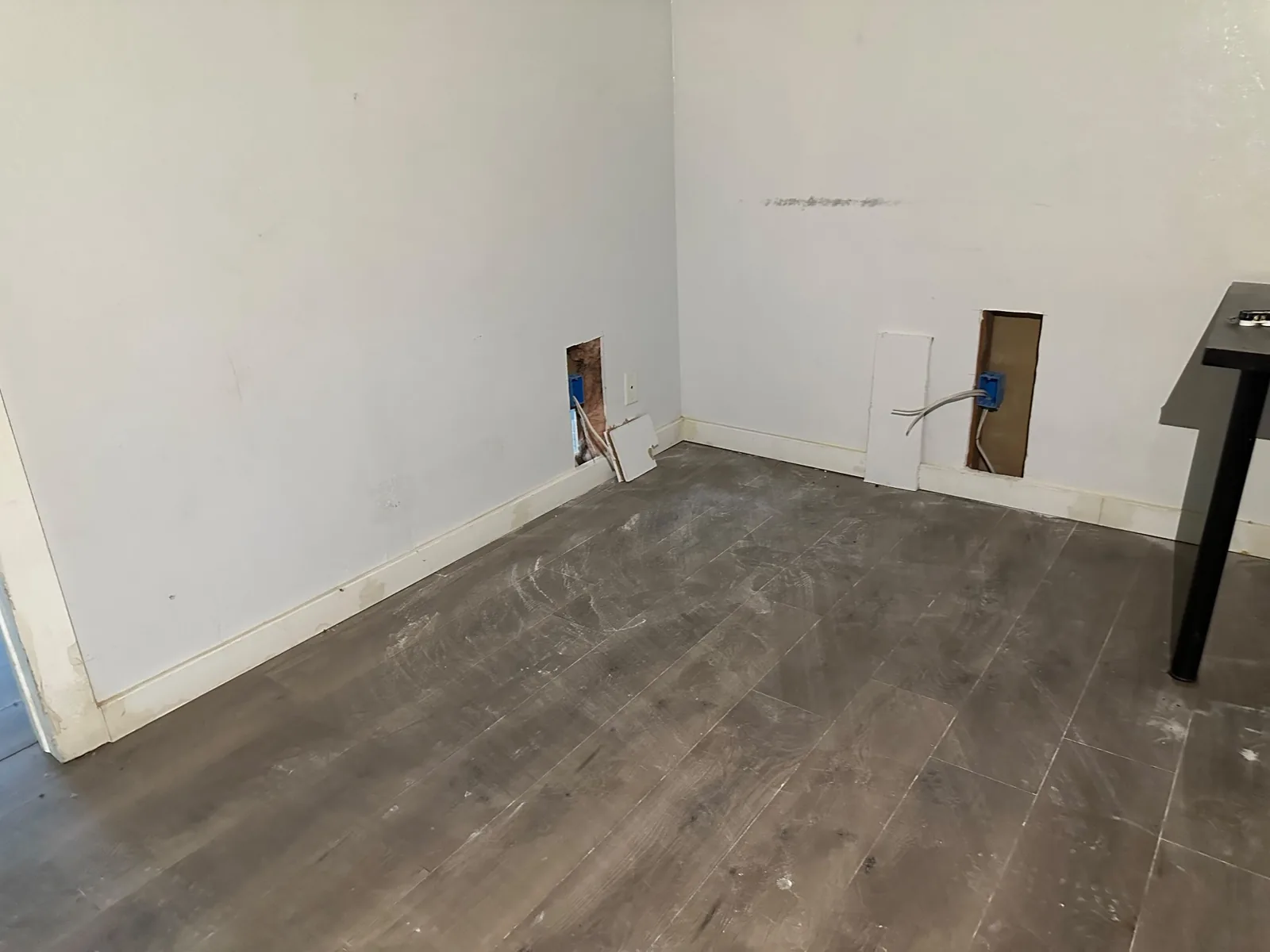 Room prepared with wall openings for new electrical wiring