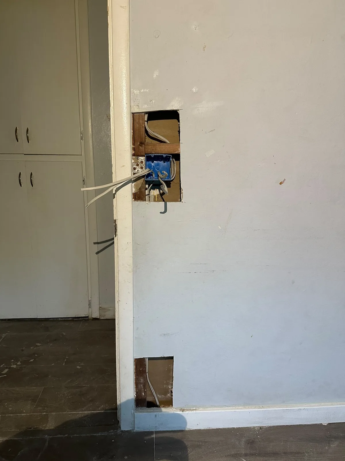 Electrical boxes prepared for new switches and outlets during whole-house rewiring